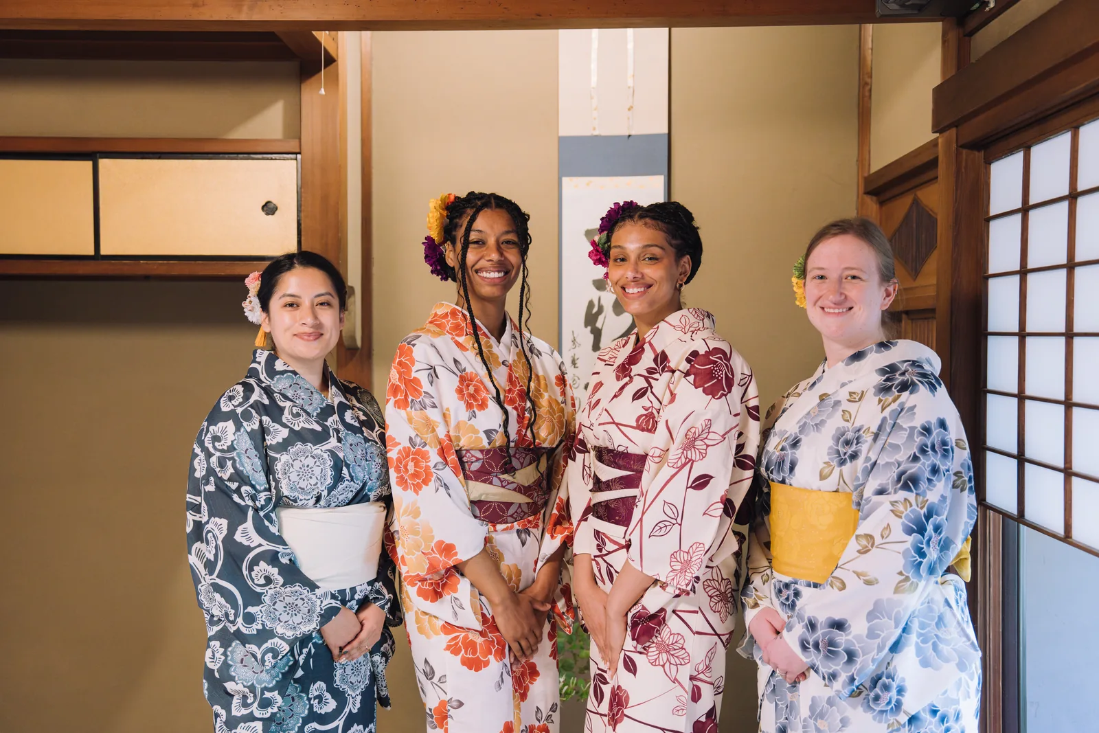 Friends smiling together in colorful kimono