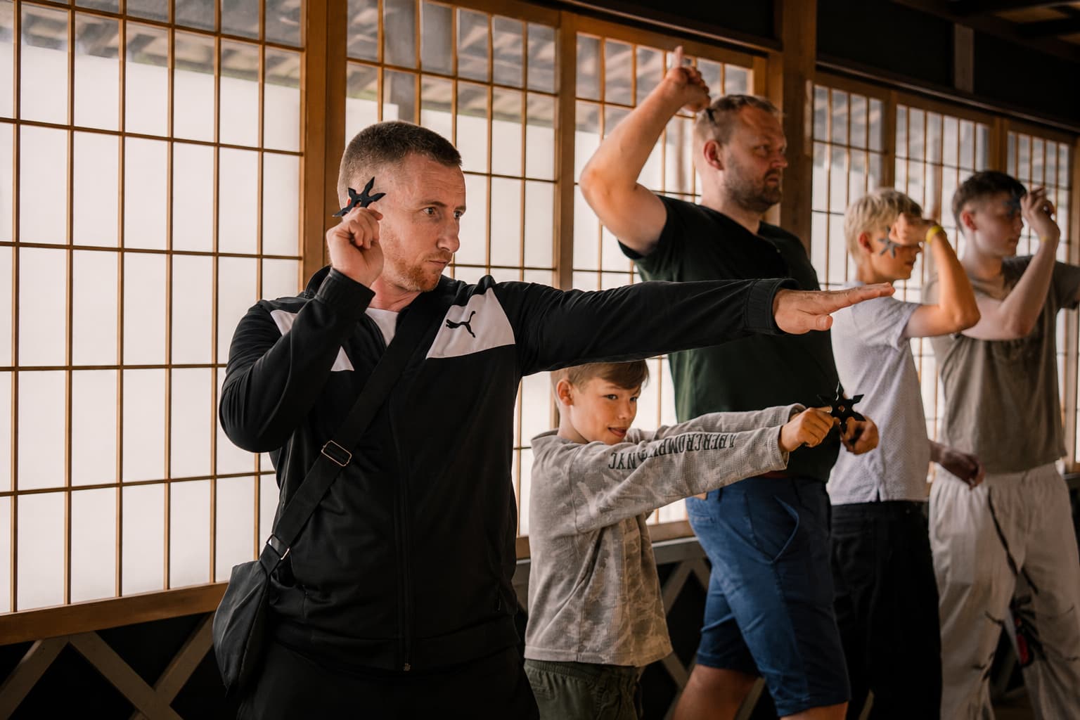 A family practicing a ninja activity together