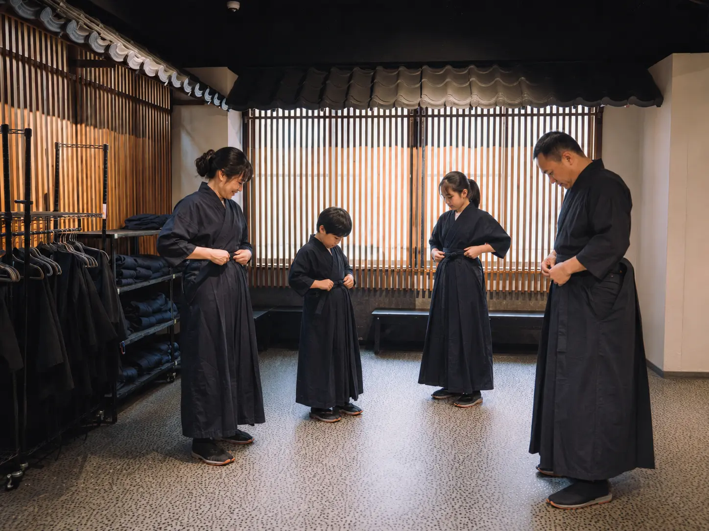 A family learning the formal beginning of a samurai lesson
